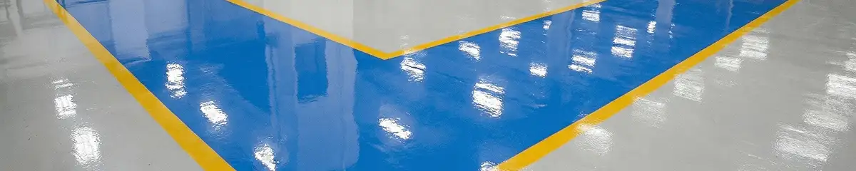 A factory floor professionally covered and marked with epoxy flooring in Dallas, TX
