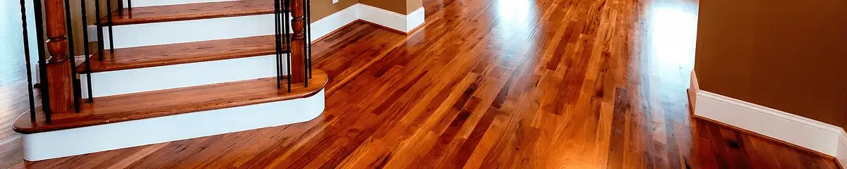Base floor of a staircase with professionally restored wood flooring in Dallas TX