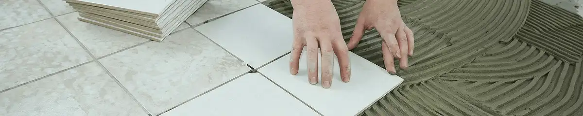 Professional installing white tile floors in Dallas, TX