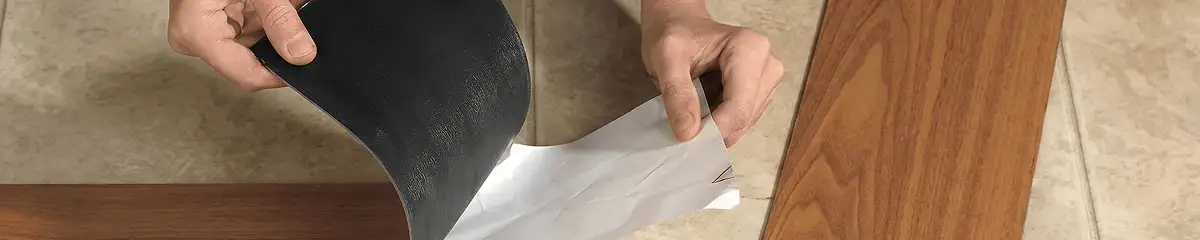 A professional installing vinyl flooring in Dallas, TX