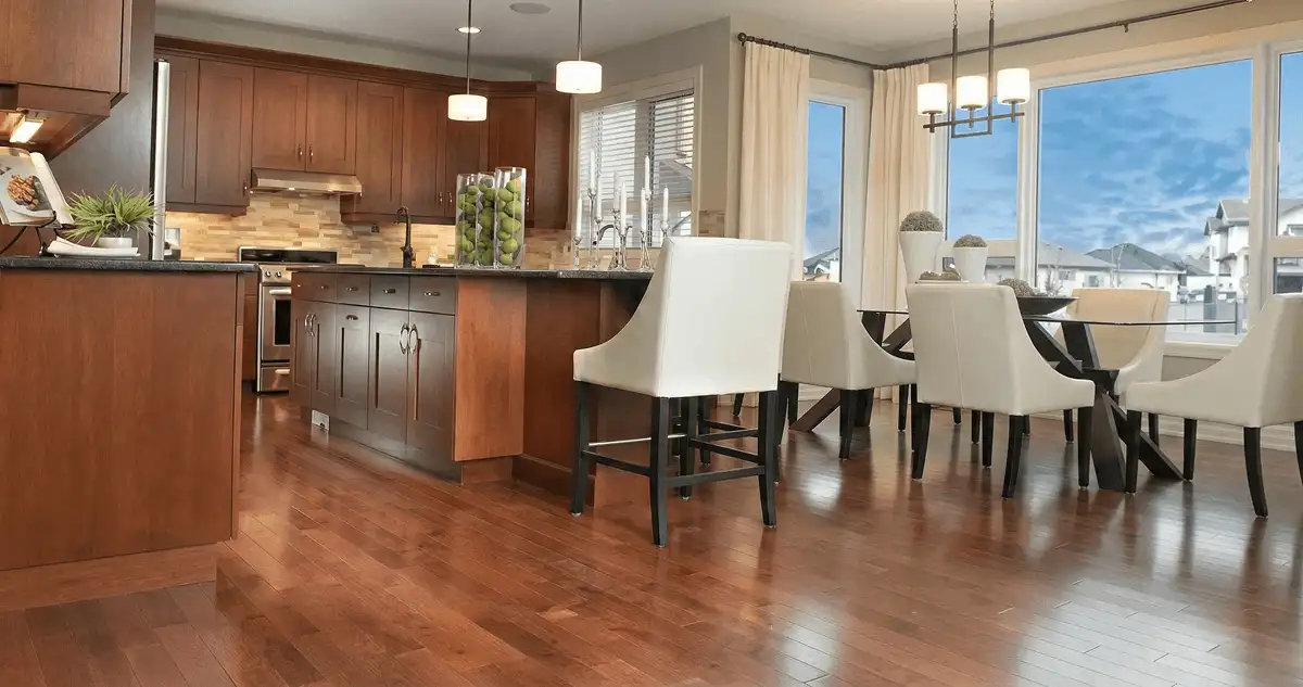 A modern kitchen with professionally installed wood flooring in Dallas, TX